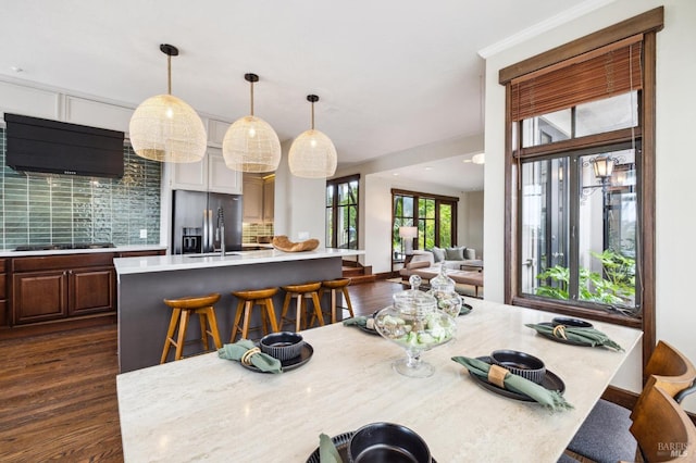 dining area with dark wood-style flooring