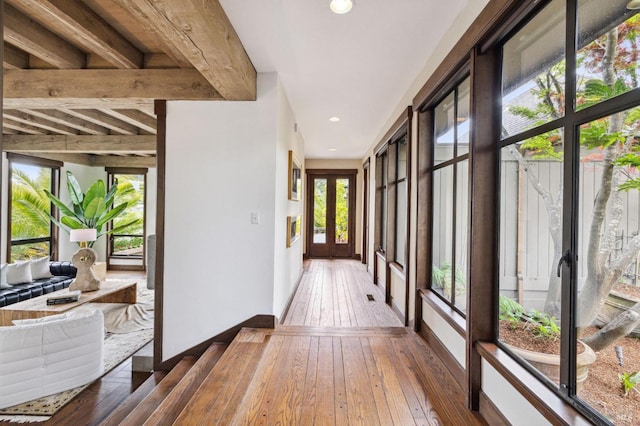 hallway with hardwood / wood-style floors and recessed lighting
