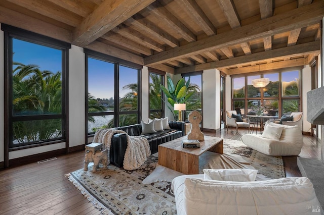sunroom with visible vents and beam ceiling