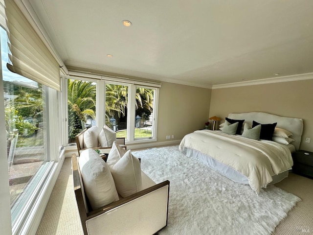 carpeted bedroom featuring crown molding