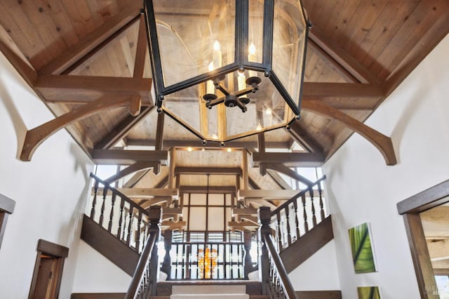 stairs featuring high vaulted ceiling and wooden ceiling