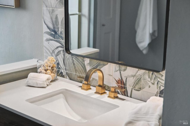 interior details featuring tasteful backsplash and vanity