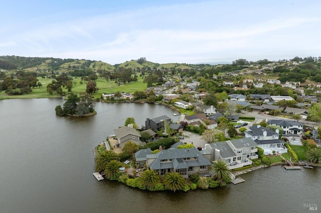 birds eye view of property with a residential view and a water view