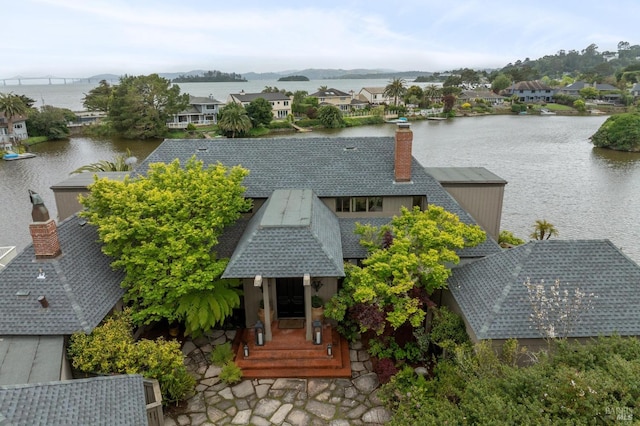 birds eye view of property featuring a water view and a residential view
