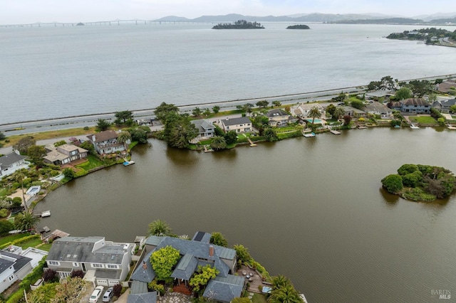aerial view with a water view and a residential view