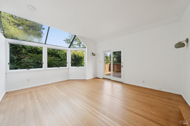 spare room with light wood-style flooring and baseboards
