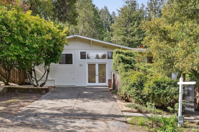 exterior space featuring french doors and fence