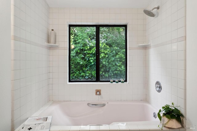 full bath with tiled bath and tiled shower