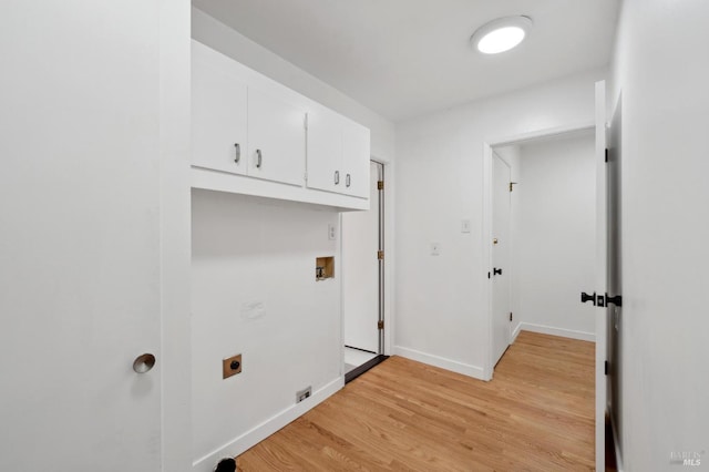 laundry room with light wood finished floors, hookup for a washing machine, baseboards, electric dryer hookup, and cabinet space