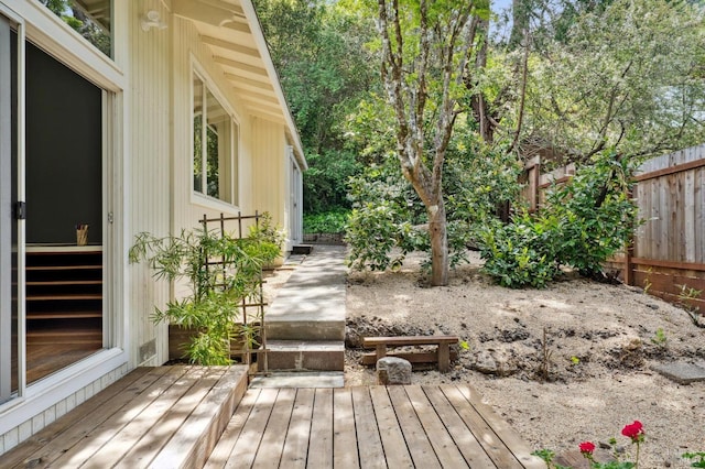 exterior space featuring fence and a deck