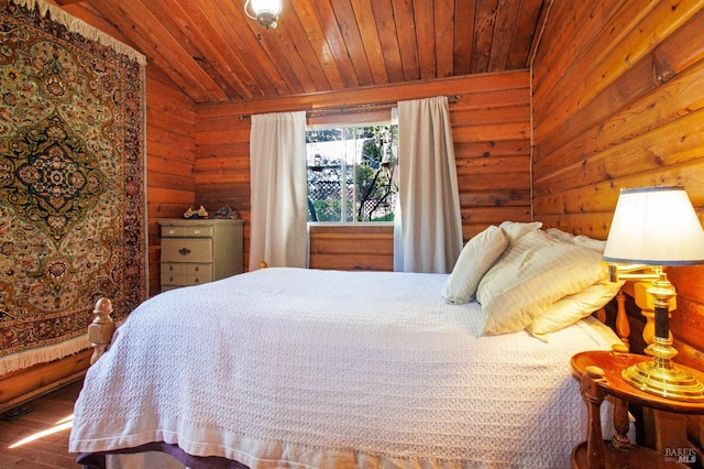 bedroom featuring wood walls, lofted ceiling, wooden ceiling, and wood finished floors