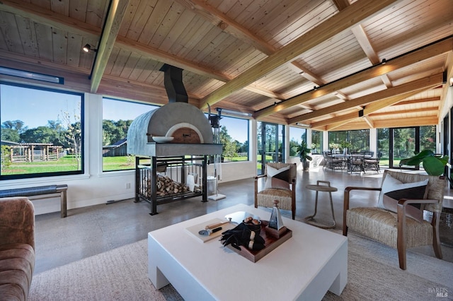 living area featuring beamed ceiling and wooden ceiling