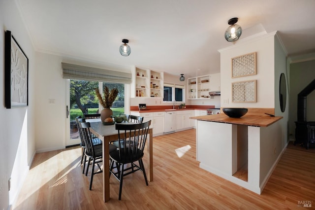 kitchen featuring white cabinets, open shelves, white dishwasher, wooden counters, and light wood-style floors
