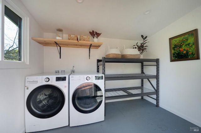 laundry area featuring washer and dryer, laundry area, and baseboards