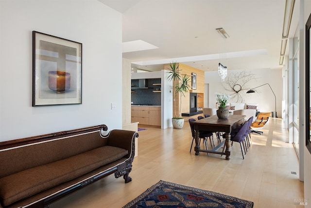 dining space featuring light wood-style floors
