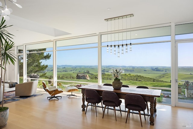 sunroom / solarium featuring a mountain view