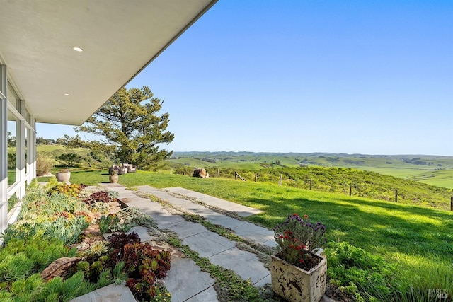 view of yard with a rural view