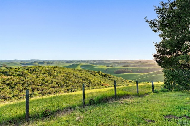 mountain view featuring a rural view