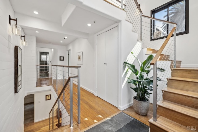 interior space with recessed lighting, baseboards, and wood finished floors