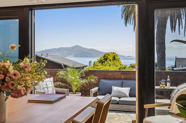 exterior space with a water and mountain view