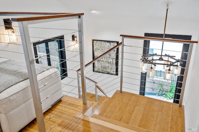 staircase with wood finished floors