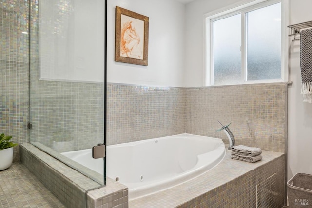 full bathroom featuring a relaxing tiled tub