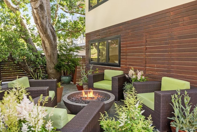 view of yard featuring a patio and an outdoor fire pit