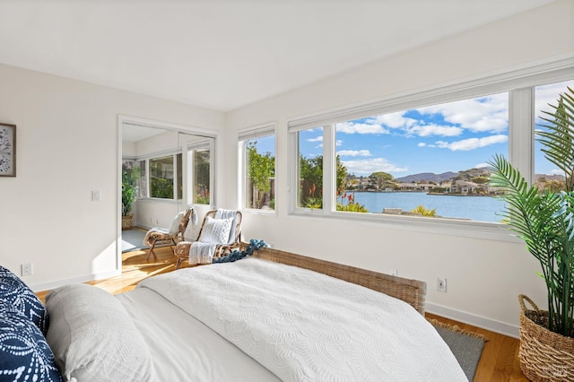 13 Leeward Rd, Belvedere, CA 94920 - bedroom featuring a water view, baseboards, and wood finished floors