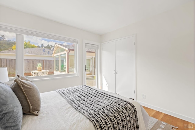 13 Leeward Rd, Belvedere, CA 94920 - bedroom with a closet, baseboards, and wood finished floors