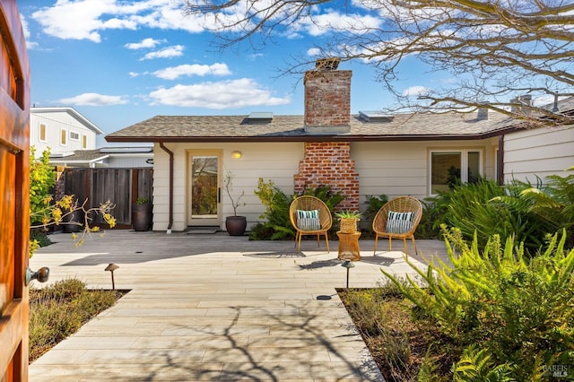 13 Leeward Rd, Belvedere, CA 94920 - back of house featuring a deck, a patio, a chimney, and fence