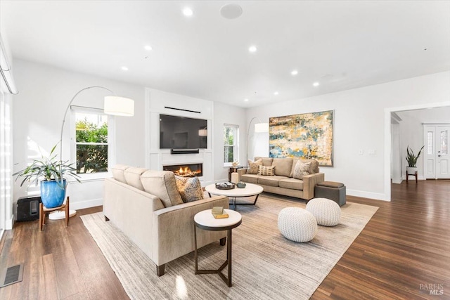 433 Tee Ct, Healdsburg, CA 95448 - living room with a lit fireplace, visible vents, recessed lighting, wood finished floors, and baseboards