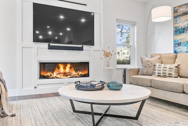 433 Tee Ct, Healdsburg, CA 95448 - living area featuring a lit fireplace and wood finished floors
