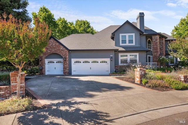 433 Tee Ct, Healdsburg, CA 95448 - view of front facade featuring an attached garage, roof with shingles, a chimney, and driveway