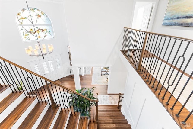 433 Tee Ct, Healdsburg, CA 95448 - staircase featuring wood finished floors, an inviting chandelier, and a towering ceiling