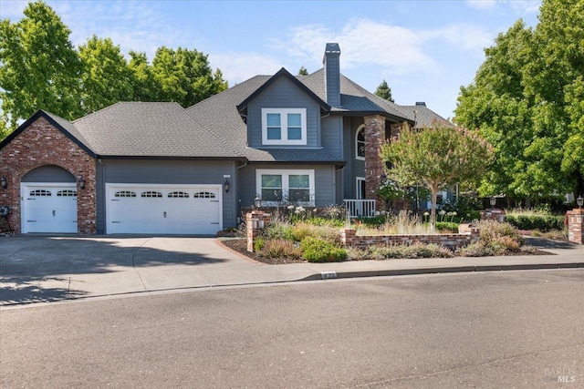 433 Tee Ct, Healdsburg, CA 95448 - view of front of home with a chimney, an attached garage, and concrete driveway