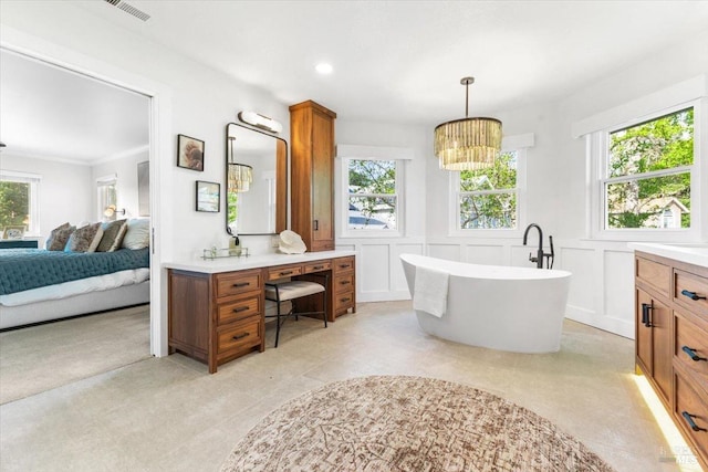 433 Tee Ct, Healdsburg, CA 95448 - ensuite bathroom with vanity, plenty of natural light, connected bathroom, visible vents, and a decorative wall