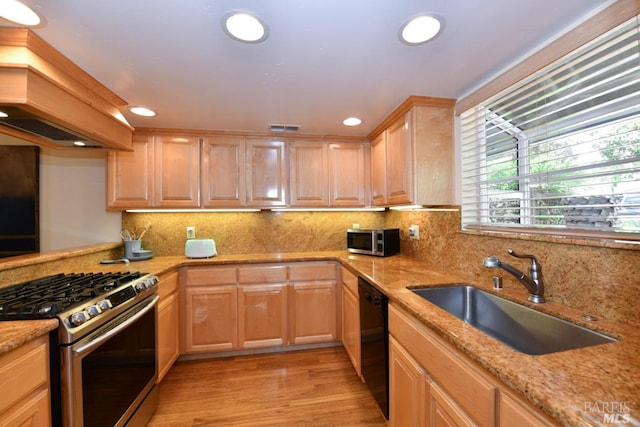 6600 Yount St Unit 40, Yountville, CA 94599 - kitchen with custom exhaust hood, a sink, appliances with stainless steel finishes, light brown cabinetry, and light stone counters