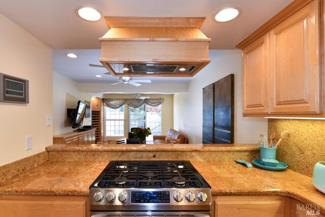 6600 Yount St Unit 40, Yountville, CA 94599 - kitchen with tasteful backsplash, light brown cabinets, a peninsula, a ceiling fan, and stainless steel gas stove
