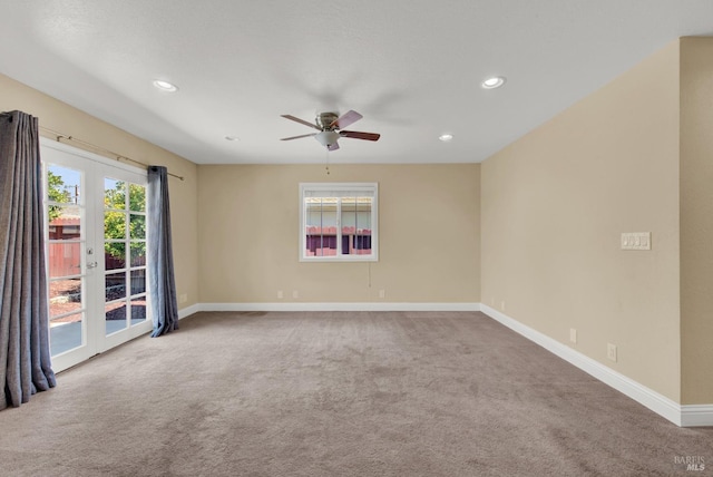 carpeted spare room featuring ceiling fan, baseboards, plenty of natural light, and recessed lighting