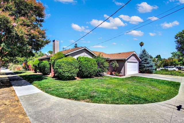 single story home with a front yard, an attached garage, and driveway