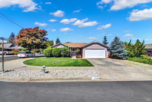ranch-style home featuring an attached garage, driveway, and a front yard