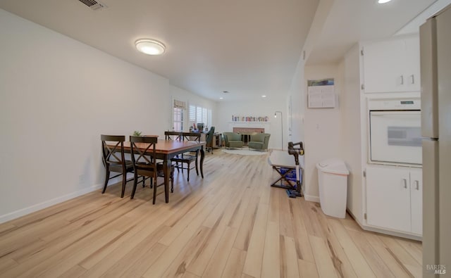 368 Lily St, Fairfield, CA 94533 - dining area featuring light wood finished floors, a brick fireplace, and recessed lighting