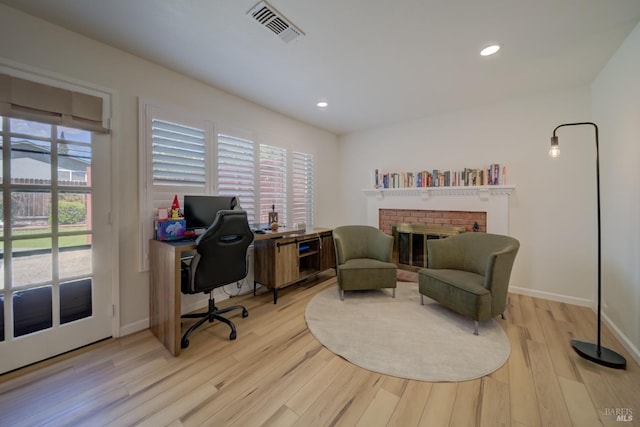368 Lily St, Fairfield, CA 94533 - home office with light wood-style floors, healthy amount of natural light, a fireplace, and recessed lighting