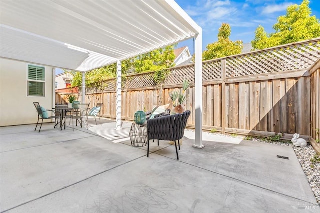 view of patio with outdoor dining space and a fenced backyard