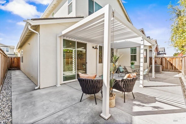 view of patio featuring a pergola and a fenced backyard