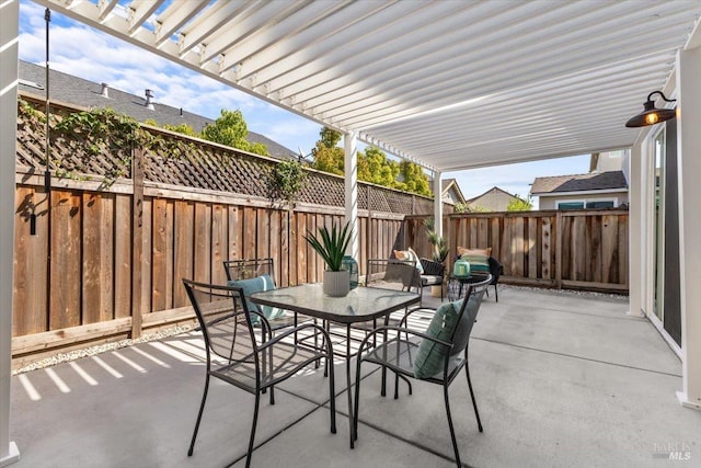 view of patio / terrace featuring a pergola, a fenced backyard, and outdoor dining area