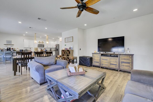 1090 Swarthmore Ct, Dixon, CA 95620 - living area featuring light wood-style flooring, ceiling fan, and recessed lighting