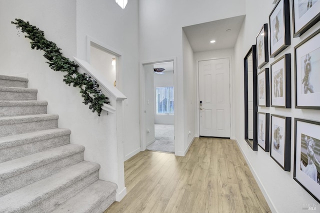 1090 Swarthmore Ct, Dixon, CA 95620 - entryway with light wood-style flooring, stairway, baseboards, and recessed lighting