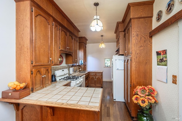 1436 Pine St, Napa, CA 94559 - kitchen featuring brown cabinets, tile counters, white appliances, and a peninsula