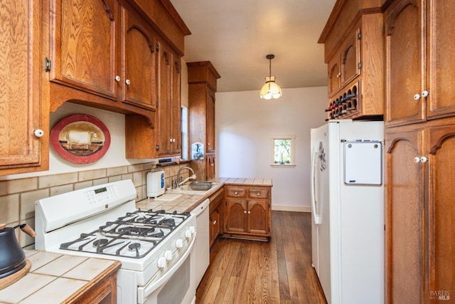 1436 Pine St, Napa, CA 94559 - kitchen featuring brown cabinetry, a sink, tile counters, and white appliances